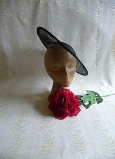 "One contoured saucer with a slight upturned brim hat sinamay straw fascinator / hat base in black that measures approximately 13\" in diameter. The base is contoured to fit against the head. The edges of the brim are finished in sinamay. The multi-layer stiffened sinamay straw has a great sturdy weave and provides excellent support for your millinery creations. This is NOT a finished hat and will not stay on your head unless you add a head band to wear. Add embellishments of your choice. A nice Fitted Sinamay Brimmed Top Hat, Fitted Sinamay Boater Hat With Short Brim, Adjustable Fedora Fascinator For Church, Adjustable Fedora-style Fascinator For Church, Fitted Black Sinamay Hat, Black Fitted Sinamay Hat, Adjustable Fedora Fascinator For Evening, Classic Fitted Fascinator With Wide Brim, Classic Wide Brim Fitted Fascinator