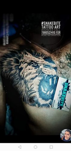 an image of a man with a tiger tattoo on his chest and the words snake bite tattoo art