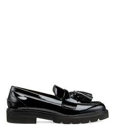 Black Slip-on Tassel Loafers For Galas, Slip-on Tassel Loafers With Brogue Detailing And Flat Heel, Slip-on Brogue Flats, Slip-on Tassel Loafers With Rubber Sole, Slip-on Tassel Loafers With Rubber Sole And Round Toe, Patent Leather Loafers With Textured Sole And Round Toe, Slip-on Oxfords With Lug Sole Flat Heel, Slip-on Oxfords With Lug Sole And Flat Heel, Flat Heel Loafers With Leather Footbed For Galas