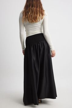 This maxi skirt features a flowy fit and a volume design. It has satin material and a stretchy, wide smocking at the waist. Luxury Voluminous Maxi Skirt, Luxury Satin Finish Flowy Maxi Skirt, Maxi Rok, Future Fashion, Satin Material, Na Kd, Skirt Black, Black Noir, Women Empowerment