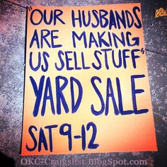 a yard sale sign posted on the side of a building