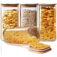 three glass containers filled with different types of pasta