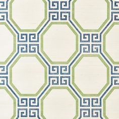 a green and blue rug with geometric designs