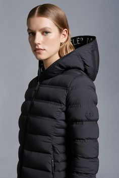 Refined and minimalistic, the Alete down jacket is emblematic of the Matt Black collection. Crafted from stretch nylon, the short puffer is enhanced with ripstop lining and a hood. Graphic logo lettering adds the finishing touch. Sporty Nylon Hooded Jacket With Padded Collar, Sporty Nylon Puffer Jacket With Double-lined Hood, Functional Nylon Puffer Jacket With Ribbed Cuffs, Down Jackets, Graphic Logo, Letter Logo, Down Jacket, Puffer, Jackets For Women