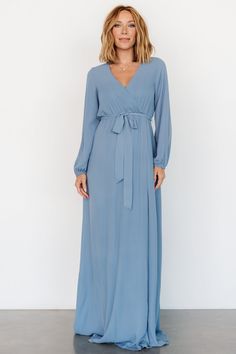 This style is perfect for a bridesmaid, wedding guest, family photoshoot, baby shower and more! Slate blue color Material has no stretch Fit runs big - if in-between sizes we recommend sizing down Faux wrap maxi skirt style Crossover V Neckline with button closure Long sleeves with elastic cuff Bump and nursing friendly Fully lined Self: 100% Polyester Lining: 97% Polyester, 3% Spandex Marianne is 5'6, cup size 34D, size 6 and wearing size S Maxi Skirt Style, Wrap Maxi Skirt, Nursing Friendly, Maxi Wrap Dress, Slate Blue, Family Photoshoot, Wrap Style, Skirt Fashion, Perfect Dress