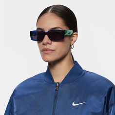 Meet the Nike Variant I. Made with mismatched details and a chunky, rectangular frame, these shades perfectly combine your sporty attitude and bold, streetwear aesthetic. Bonus: they’re made from at least 20% recycled content by weight. Blue Sunglasses With Uva Protection For Streetwear, Blue Sunglasses With Uv Protection For Streetwear, Blue Uv Protection Sunglasses For Streetwear, Blue Mirrored Sunglasses For Streetwear, Trendy Blue Sunglasses For Streetwear, Trendy Blue Streetwear Sunglasses, Modern Blue Sunglasses For Streetwear, Casual Blue Everyday Sunglasses, Casual Tinted Lenses Sunglasses For Streetwear