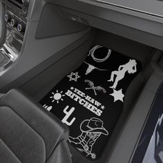 the interior of a car with various stickers and symbols on it's floor