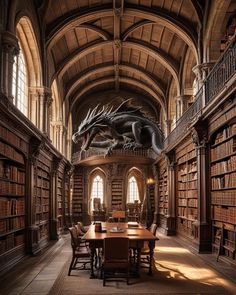 a large room with many bookshelves filled with books and a dragon statue hanging from the ceiling