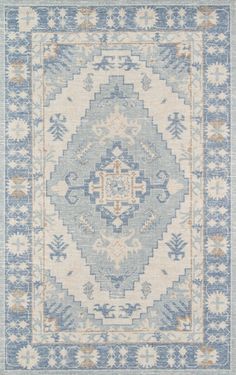 a blue and white rug with an intricate design on the bottom, in different colors