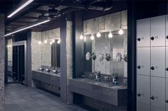 a public restroom with several sinks and mirrors