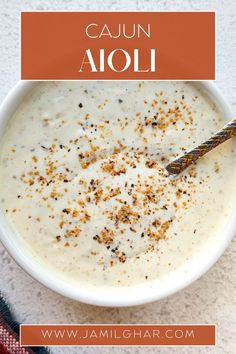 a bowl of cajun aioli with a spoon in it and the title overlay reads, cajun aloi