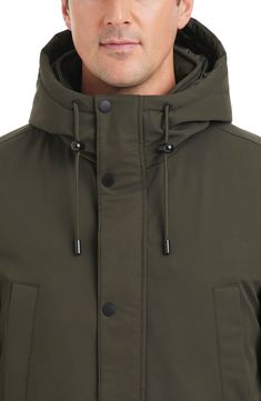 A stretchy, water-resistant shell keeps you moving comfortably through the elements in a lightly insulated coat that transitions easily from season to season and offers a drawcord hood for added protection against rain, snow and cold. Front zip closure with snap storm placket Drawcord-toggle hood Adjustable snap cuffs Chest welt pockets; front flap pockets Internal drawcord waist Quilted lining, with 100% polyester fill Water resistant Wrinkle resistant 92% polyester, 8% spandex Machine wash, tu Solid Parka With Double-lined Hood For Rainy Weather, Modern Hooded Weatherproof Windbreaker, Modern Weatherproof Hooded Windbreaker, Modern Raincoat With Detachable Hood For Outdoor, Modern Outdoor Raincoat With Detachable Hood, Weatherproof Hooded Nylon Parka, Modern Parka With Adjustable Hood For Outdoor, Parka With Detachable Hood For Rainy Weather, Functional Solid Parka With Double-lined Hood