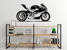 a wall decal with a motorcycle on the side and shelves in front of it