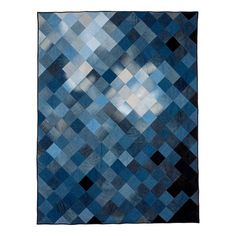 a blue and black rug with squares on it