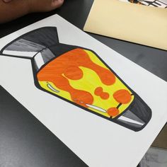 a child's drawing of a toaster with orange and yellow flames on it