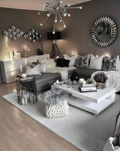 a living room filled with lots of furniture and decor