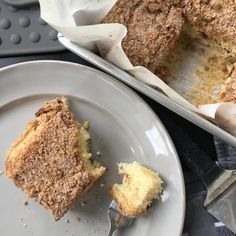 a piece of cake sitting on top of a white plate next to a pie pan