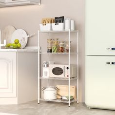 a white refrigerator freezer sitting next to a shelf filled with food