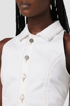 Description Our Halter Vest in White is a standout vest cut from premium comfort stretch denim with a pointed collar and button up front. Finished with contrast thread detailing. Product Details Body Length: 19.5", Chest: 32.25"Model Height 5'9"Model wearing size SMeasurements based on size S Fit & Care Content: 99% Cotton, 1% ElastaneMachine wash cold with like colorsDo not bleachTumble dry low or hang to dry Fitted Cropped Denim Vest With Button Closure, White Fitted Denim Vest, Fitted Denim Vest With Snap Buttons For Work, Fitted Denim Vest With Button Closure For Work, White Button-up Vest, White Button-up Vest With Button Closure, Casual White Sleeveless Denim Vest, White Sleeveless Denim Vest For Spring, White Fitted Vest With Button Closure