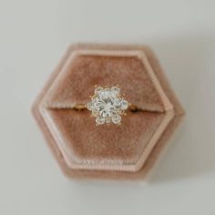 an engagement ring in a velvet box