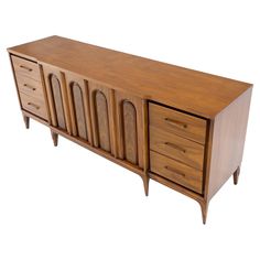 a large wooden cabinet with drawers on one side