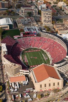 an aerial view of the football stadium with red and white fans in it's stands