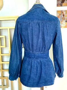 "Vintage 70s blue denim jacket by Country Blues, Sebastopol, CA. Medium weight denim with brass buttons down the front and on the cuffs. Classic 70s styling. Excellent vintage condition with no obvious flaws. Fits a Small. However, please refer to the garment measurements to ensure a proper fit. Bust: 38\" Waist: 27\" Hips: 42\" Length: 25\" All items are sold AS IS. These are vintage pieces, 20 plus years old! I may miss flaws or condition issues. Please expect imperfections! Additional measure Fitted Collared Denim Jacket With Pockets, Fitted Dark Wash Collared Outerwear, Vintage Dark Wash Button-up Denim Jacket, Fitted Collared Denim Jacket In Denim Blue, Fitted Collared Denim Jacket With Buttons, Fitted Collared Denim Jacket, Vintage Button-up Denim Outerwear, Vintage Denim Blue Button-up Outerwear, Vintage Denim Button-up Outerwear