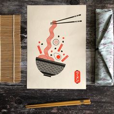 a card with chopsticks, rice and noodles on it next to a napkin