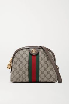 Gucci proves once again that its bags gain cult status as soon as they debut - it wasn't long after the Resort '18 runway before we saw this 'Ophidia' style on the arms of editors and influencers. Made from printed coated-canvas, it's trimmed with dark-brown textured-leather and the house's signature green and red webbing. We're struggling to think of outfits that it won't work with. Gucci Handbags Crossbody, Gucci Ophidia Bag, Oval Bag, Horsebit Loafers, Gucci Ophidia, Brown Texture, Favorite Handbags, Print Coat, Brown Coat