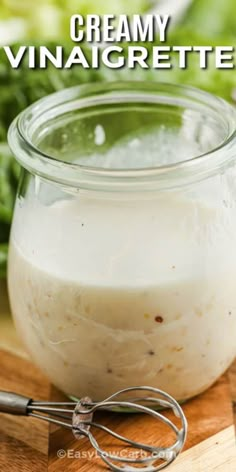 a jar filled with cream sitting on top of a wooden cutting board