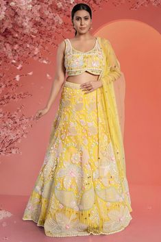 Indulge in elegance with our Bridal Lehenga BL-339. Featuring a stunning blend of vibrant yellow and multi-color hues, this lehenga is embellished with delicate pearls, making it the perfect choice for any bride. And the best part? It's also perfect for sisters looking to make a statement at the sangeet ceremony. Elevate your wedding ensemble with this luxurious piece.