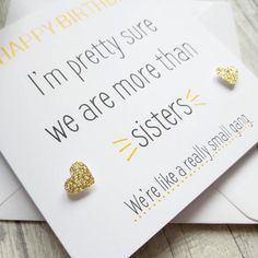 there is a card with two gold hearts on it and the words i'm pretty sure we are more than sisters