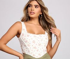 Infuse your look with a floral top that keeps it sweet and stylish. The crop top features a floral print. a sleeveless square neckline. a corset-like bodice. tank straps. and a lace-up back. Complete the look with a ruched mini skirt and mules for a... Day Date Outfit, Crop Top Styles, Lace Bustier Top, Ruched Mini Skirt, Date Outfit, Corset Crop Top, Lace Bustier, Pink Prom Dresses, Cropped Tops