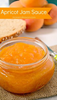 apricot jam sauce in a glass jar next to bread