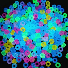 glow in the dark plastic beads for making bracelets or necklaces, assorted sizes and colors