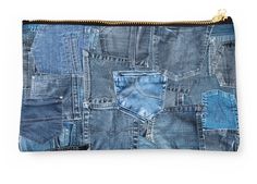 a zippered pouch bag made out of blue jeans