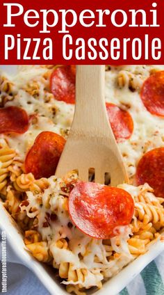 pepperoni pizza casserole in a white dish with a wooden spoon