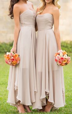 two bridesmaids holding bouquets in their hands and wearing dresses with different colors