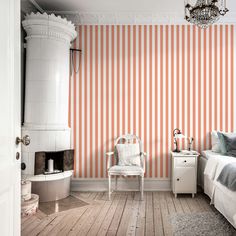 an orange and white striped wall in a bedroom