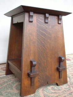 a wooden table with two doors on each side