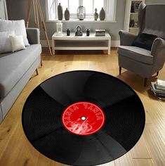 a living room with a vinyl record rug on the floor