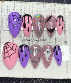 Pink and Purple Halloween Nails/ Handmade Reusable Press on Nails/ Cute and Spooky Nails Model: Short stiletto Please read full description below. This set features:  Thumb - pink or purple background with handpainted spider web Index, pinky - pink or purple background with handpainted black drip design Middle - reflective fine pink glitter background with holographic glitter accents Ring - reflective fine pink glitter background with ghost or bat design Glossy finish Gel polish. I offer quality Cutest Halloween Nails, Horror Stilleto Nails, Pink Goth Nails Short, Halloween Fairy Nails, Goth Disney Nails, Pastel Witch Nails, Teal Halloween Nails, Pink And Purple Halloween Nails, Birthday Disney Nails