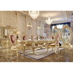 a fancy dining room with gold furniture and chandelier hanging from the ceiling over a wooden floor