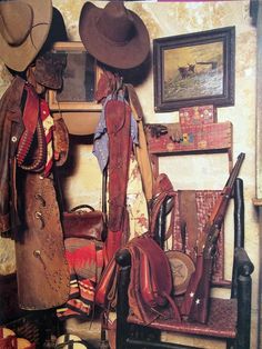 there are many hats and purses on the shelf next to each other in this room