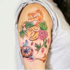 a woman's arm with tattoos on it and an image of a bird in the middle