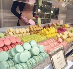 a display case filled with lots of colorful macaroons