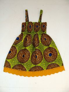 Assorted Infant/ Baby African Print Ankara Dress by dorisanddoris Cotton Sundress For Babies For Beach, Cotton Floral Print Sundress For Playtime, Cotton Smocked Sundress For The Beach, Cotton Smock Sundress For The Beach, Cotton Smock Sundress For Beach, Beach Cotton Smock Sundress, Fitted Cotton Sundress With Ruffles, Sleeveless Smocked Cotton Sundress, Cute Yellow Dresses With Lace Trim