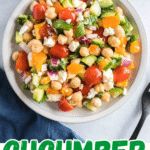 a bowl filled with chopped vegetables next to a fork and spoon on top of a table