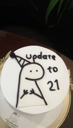 a white cake with black writing on it that says update to 21 / 2 - 1