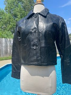 "Cute, cropped 1990s patchwork style black leather jacket from Italian Stone Design Navarre Leather Company  Size Medium  Jacket does have some light wear but is overall great condition. Leather is soft and jacket is fully lined and has an inside pocket.  Measurements  Bust 40\" Waist 38\" Length 20\" Sleeve 22\"" Fitted Black Leather Jacket With Patchwork, Style Black Leather Jacket, Italian Stone, Pensacola Fl, Leather Company, Womens Jackets, Stone Design, Black Leather Jacket, Inside Pocket